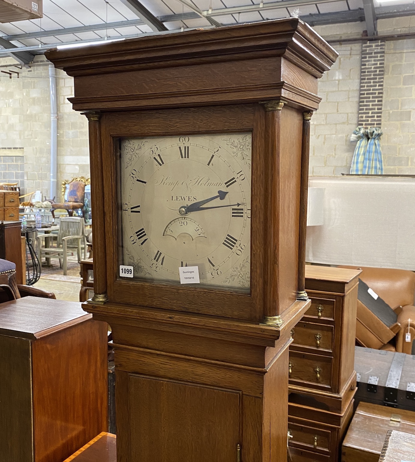 An 18th century oak thirty hour longcase clock by William Kemp and John Holman, Lewes, the 11in. silvered dial with calendar aperture, height 199cm